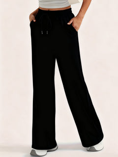 Photo: Kensington Drawstring Wide-Leg Trousers | Seoden London — view 7