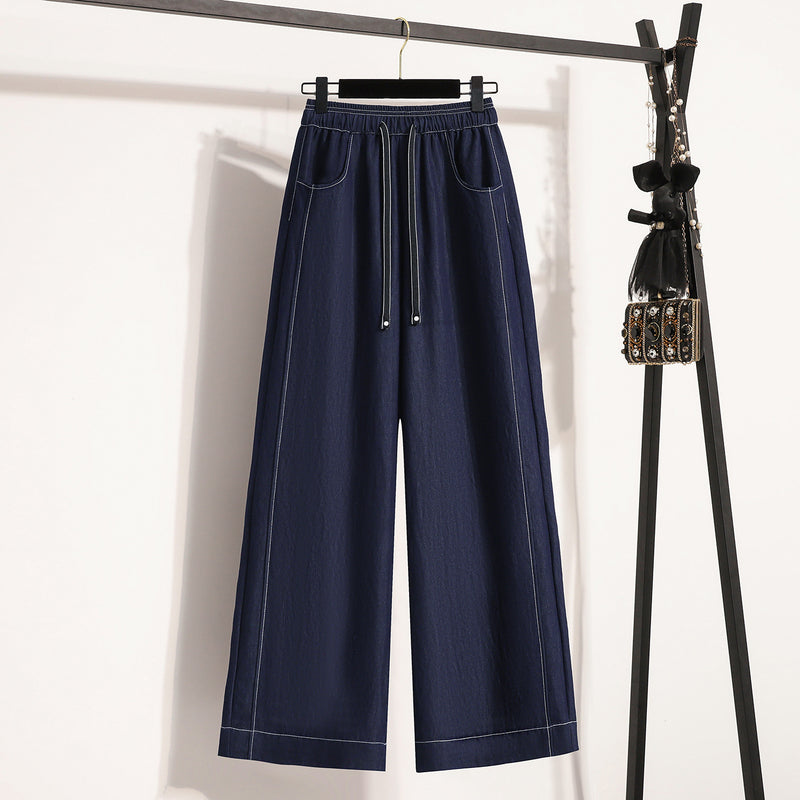 Photo: Nantes Denim-Blue Wide-Leg Trousers | Seoden London
