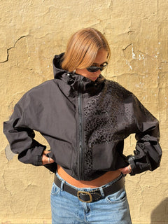 Photo: Serengeti Water-Reactive Leopard Rain Jacket | Seoden London — view 7